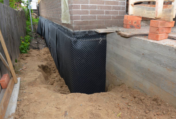 Happy homeowners after waterproofing job in Mentor